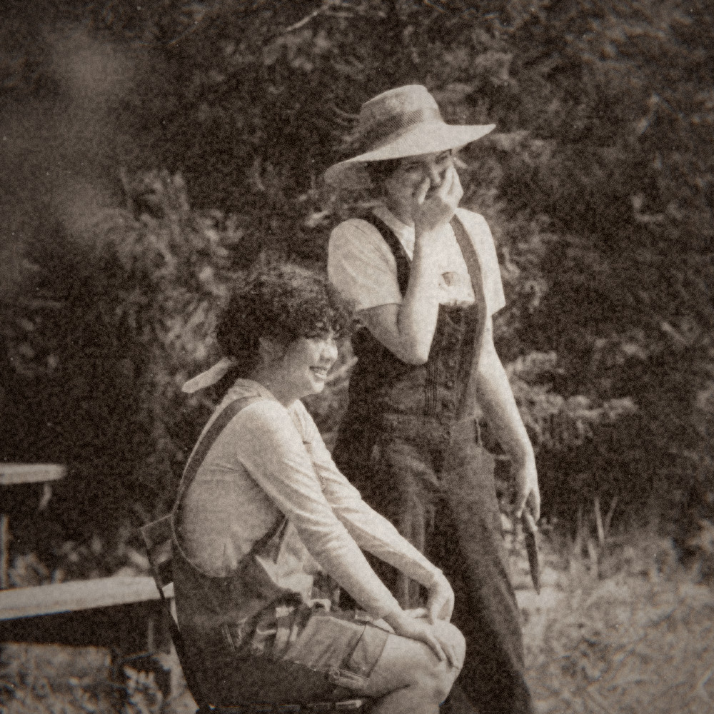 Two friends laughing with the 1895 vintage photo look