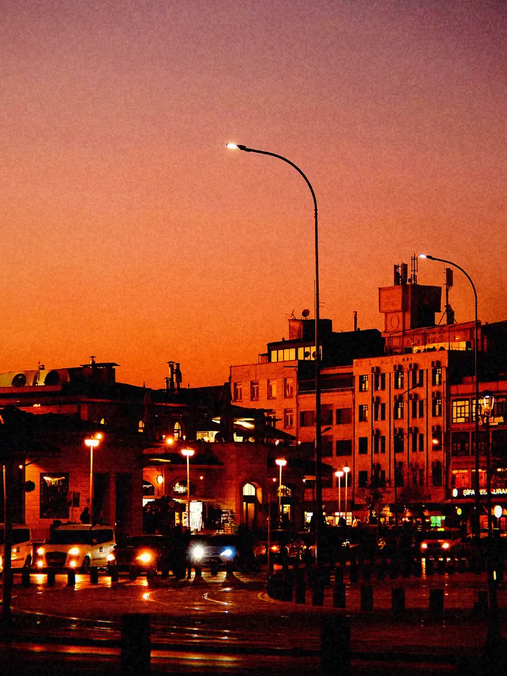 A waterfront street with lamp posts at sunset — 2009 · Early Phone Cam