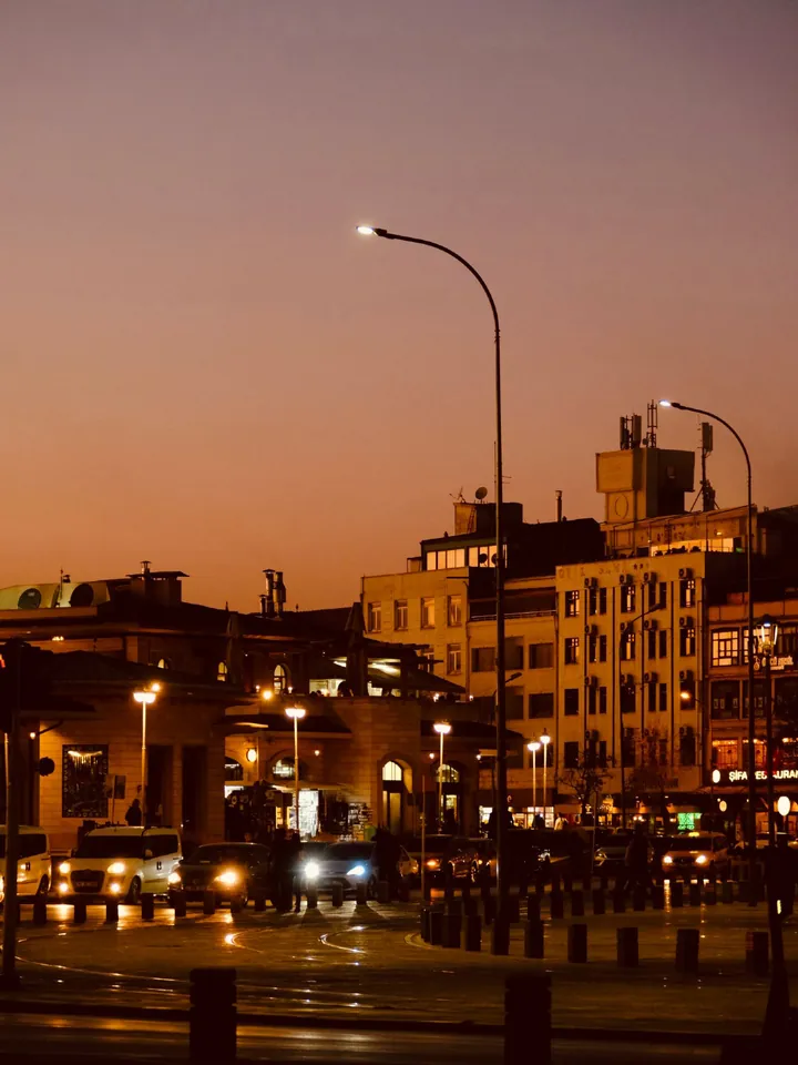 A waterfront street with lamp posts at sunset — Original photograph