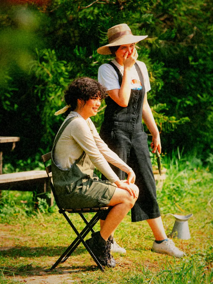 Two friends laughing outdoors — 1998 · Disposable Flash