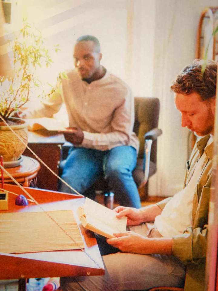 Two friends reading in a sunny room — 1972 · Instant Fold
